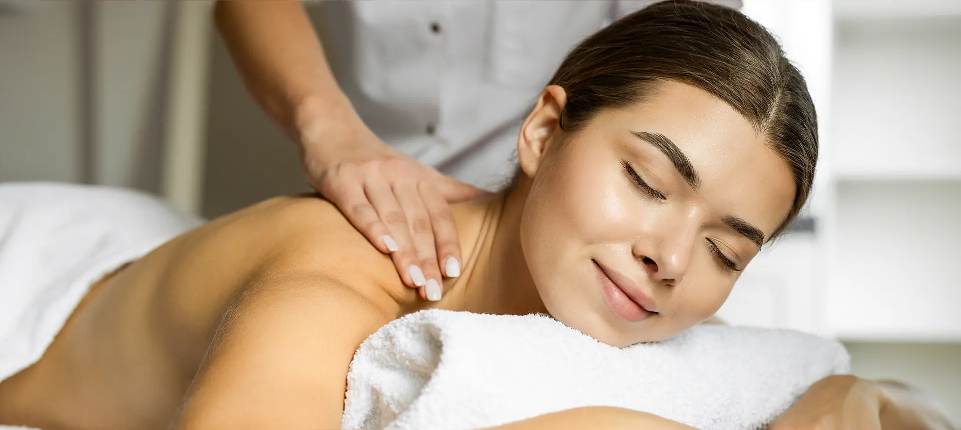 Woman enjoying a relaxing neck and shoulder massage.